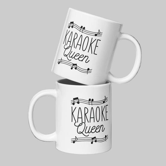 Two white glossy Printful mugs featuring a 'Karaoke Queen' design with musical notes.